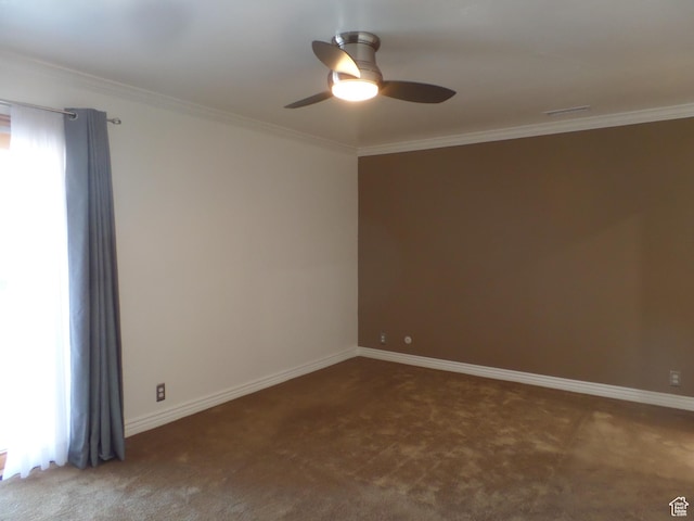 empty room featuring ornamental molding, carpet flooring, and ceiling fan