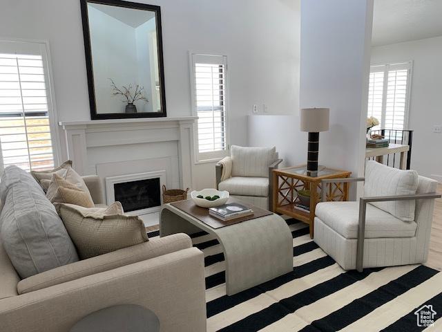 1107 E Brigadoon Ct, Holladay, UT 84117 - living room with healthy amount of natural light and a glass covered fireplace