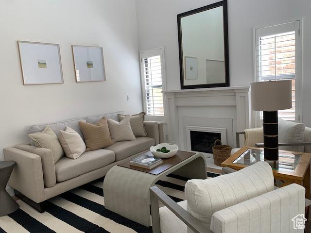 1107 E Brigadoon Ct, Holladay, UT 84117 - living room featuring healthy amount of natural light and a fireplace
