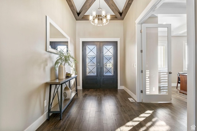 1595 E Duggan Dr, Eagle Mountain, UT 84005 - entrance foyer featuring dark wood-type flooring, an inviting chandelier, beam ceiling, coffered ceiling, and french doors