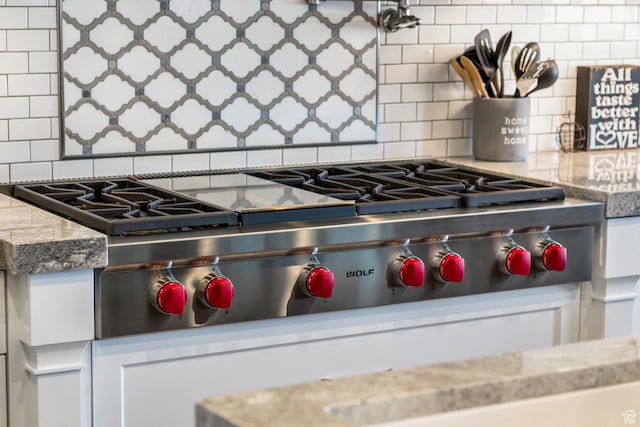 1595 E Duggan Dr, Eagle Mountain, UT 84005 - details with white cabinetry and stainless steel gas cooktop