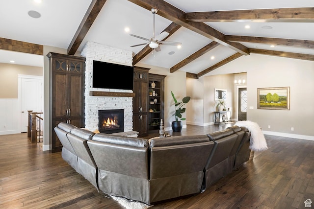 1595 E Duggan Dr, Eagle Mountain, UT 84005 - living room with ceiling fan, a stone fireplace, dark hardwood / wood-style flooring, and vaulted ceiling with beams