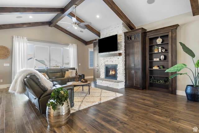 1595 E Duggan Dr, Eagle Mountain, UT 84005 - living room featuring lofted ceiling with beams, a stone fireplace, dark wood-type flooring, and ceiling fan