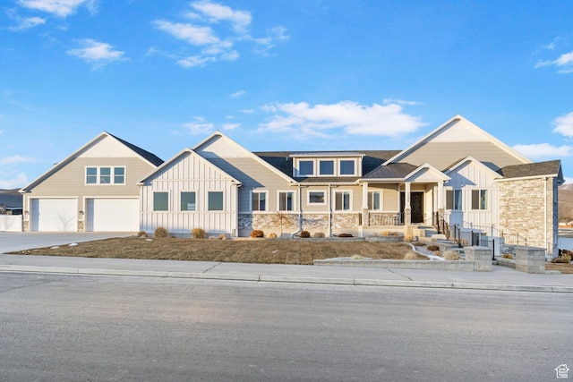 1595 E Duggan Dr, Eagle Mountain, UT 84005 - craftsman-style house featuring a garage and covered porch
