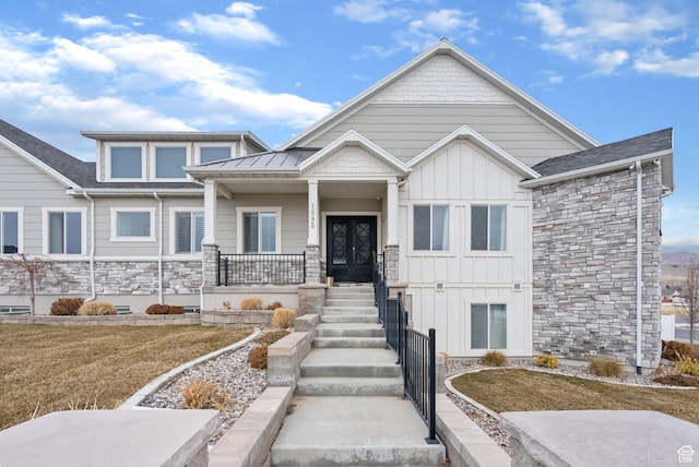 1595 E Duggan Dr, Eagle Mountain, UT 84005 - craftsman-style home featuring a porch, french doors, and a front lawn