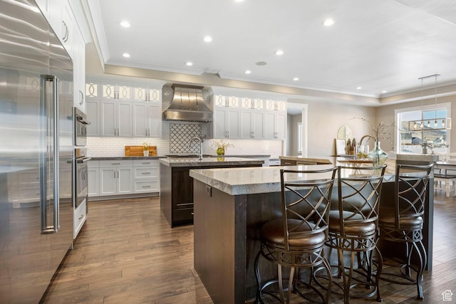 1595 E Duggan Dr, Eagle Mountain, UT 84005 - kitchen featuring decorative light fixtures, high end refrigerator, an island with sink, and wall chimney exhaust hood