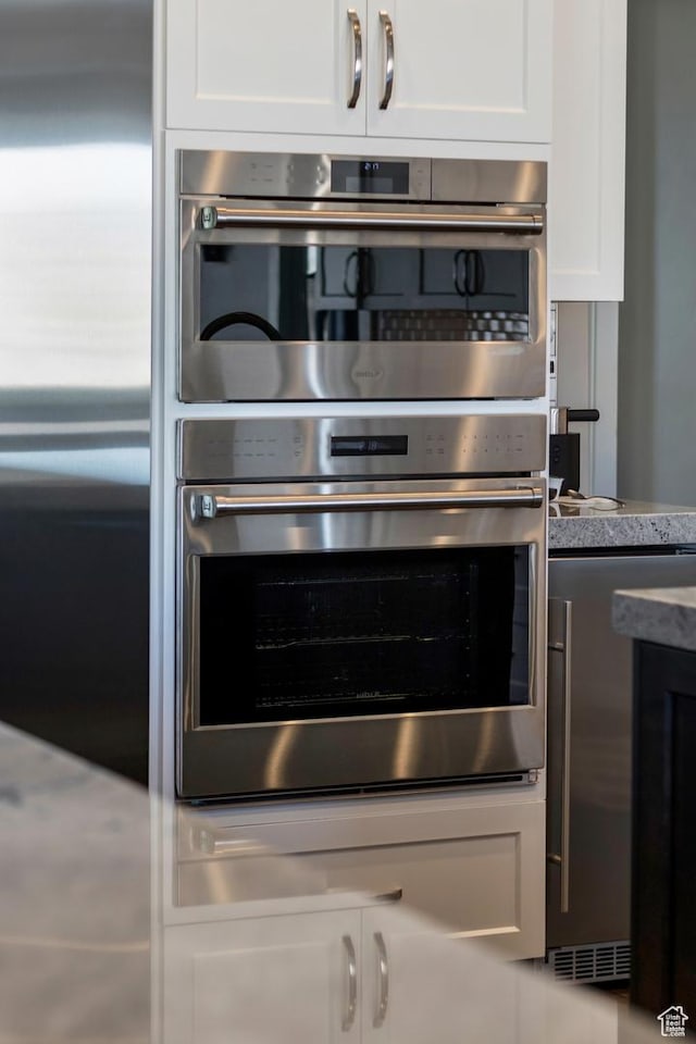 1595 E Duggan Dr, Eagle Mountain, UT 84005 - kitchen featuring stainless steel appliances and white cabinetry