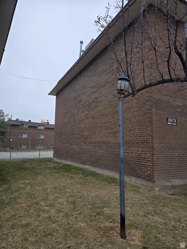 3673 S 2200th St W Unit 13, West Valley City, UT 84119 - view of side of property with a yard