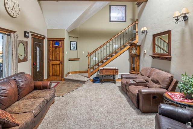 living room featuring high vaulted ceiling and carpet flooring