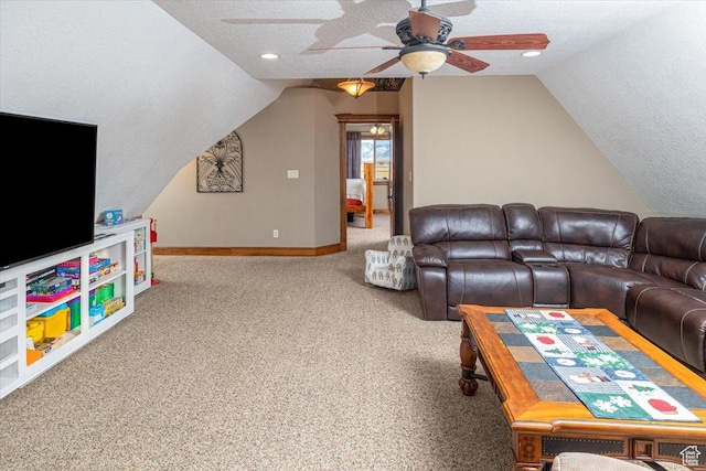 carpeted living room with ceiling fan, vaulted ceiling, and a textured ceiling