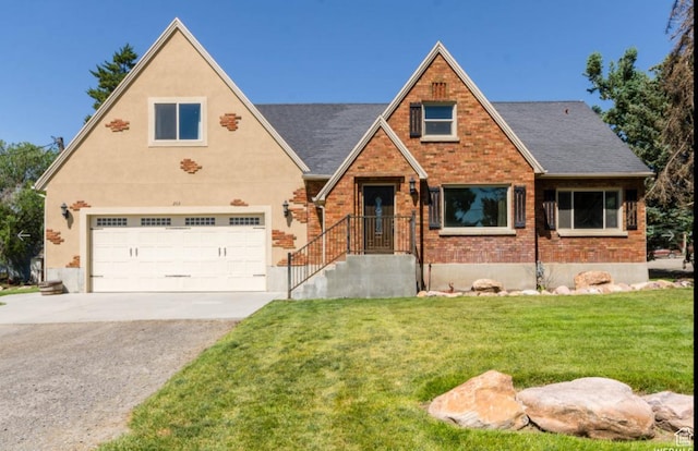 view of front of house with a garage and a front lawn