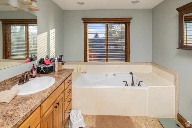 bathroom with vanity and a bathing tub