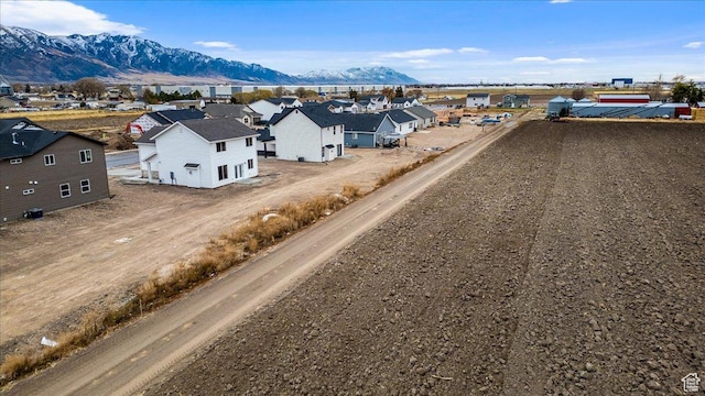 birds eye view of property featuring a mountain view