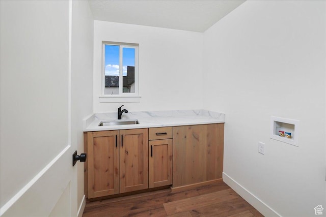bathroom with sink and wood-type flooring