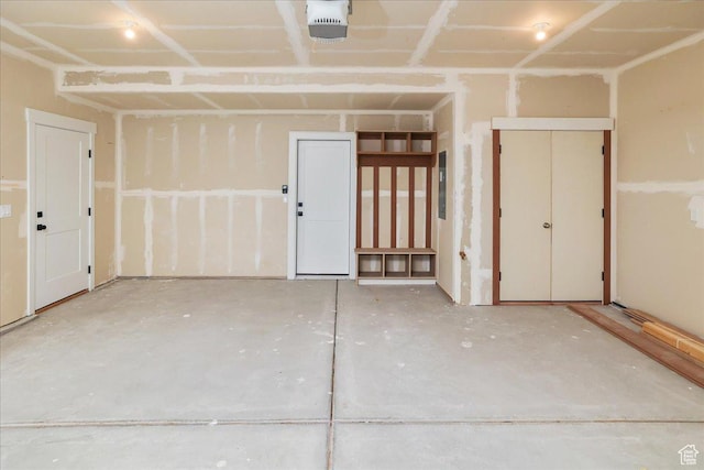 garage featuring a garage door opener and electric panel