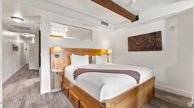 1476 Newpark Blvd Unit 210, Park City, UT 84098 - bedroom with beam ceiling and wood-type flooring