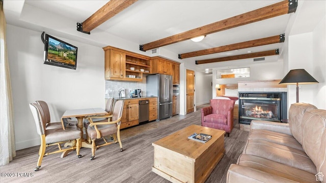 1476 Newpark Blvd Unit 210, Park City, UT 84098 - living room with beam ceiling, sink, and light hardwood / wood-style flooring