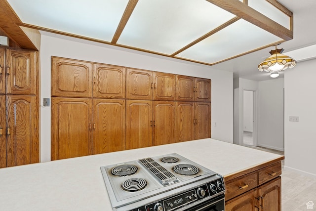 kitchen featuring light hardwood / wood-style floors and electric range