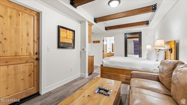 1456 Newpark Blvd Unit 215, Park City, UT 84098 - bedroom featuring beamed ceiling and hardwood / wood-style flooring