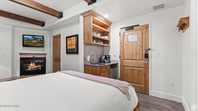 1456 Newpark Blvd Unit 215, Park City, UT 84098 - bedroom featuring dark hardwood / wood-style flooring, sink, and beamed ceiling