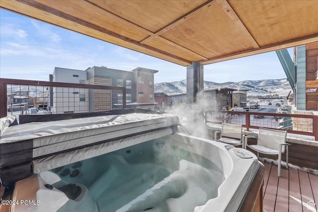 1456 Newpark Blvd Unit 215, Park City, UT 84098 - snow covered deck with a mountain view and a covered hot tub