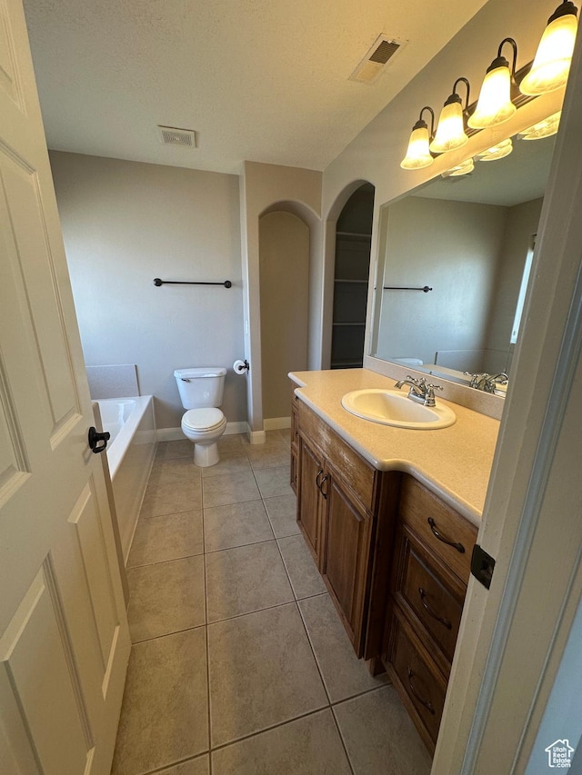 1288 N Cedar Blvd Unit 38-F, Cedar City, UT 84721 - bathroom with tile patterned floors, toilet, a bath, and vanity