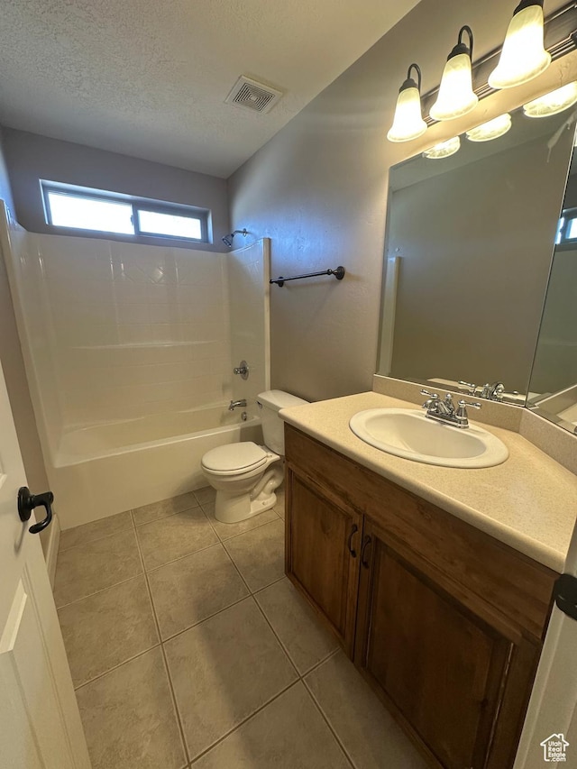 1288 N Cedar Blvd Unit 38-F, Cedar City, UT 84721 - full bathroom featuring bathing tub / shower combination, tile patterned flooring, vanity, a textured ceiling, and toilet