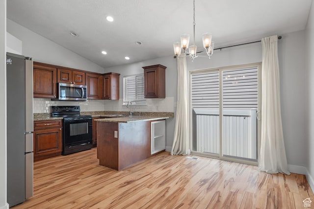 3731 N Tumwater Dr W, Eagle Mountain, UT 84005 - kitchen featuring stainless steel appliances, backsplash, vaulted ceiling, light wood finished floors, and a chandelier
