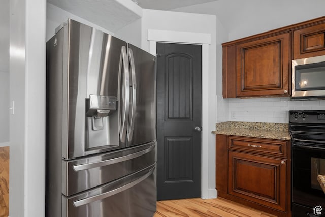 3731 N Tumwater Dr W, Eagle Mountain, UT 84005 - kitchen with stainless steel appliances, light wood-style flooring, light stone countertops, and backsplash