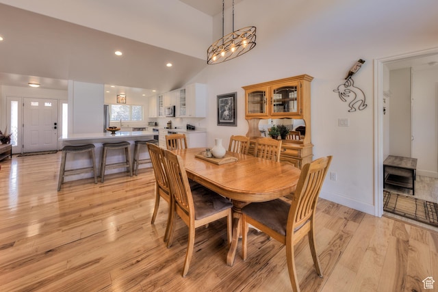 4230 S Beeman Rd, Moab, UT 84532 - dining space featuring high vaulted ceiling and light hardwood / wood-style floors