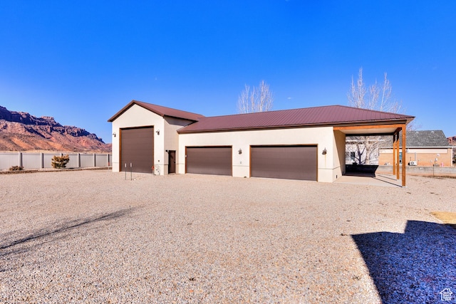 4230 S Beeman Rd, Moab, UT 84532 - view of front facade featuring a garage and a mountain view