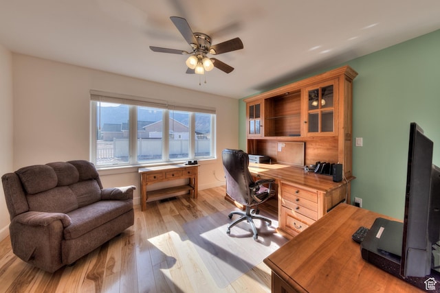 4230 S Beeman Rd, Moab, UT 84532 - home office featuring light hardwood / wood-style floors and ceiling fan