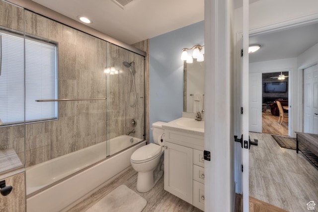 4230 S Beeman Rd, Moab, UT 84532 - full bathroom featuring enclosed tub / shower combo, wood-type flooring, vanity, and toilet