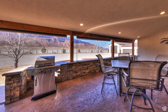 4230 S Beeman Rd, Moab, UT 84532 - view of patio with a mountain view and grilling area