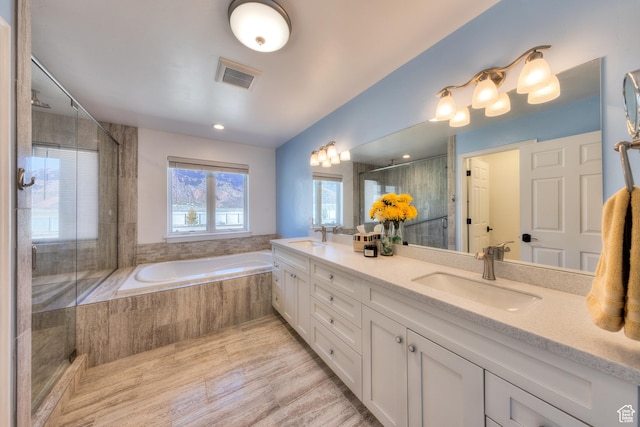 4230 S Beeman Rd, Moab, UT 84532 - bathroom featuring hardwood / wood-style flooring, vanity, and shower with separate bathtub