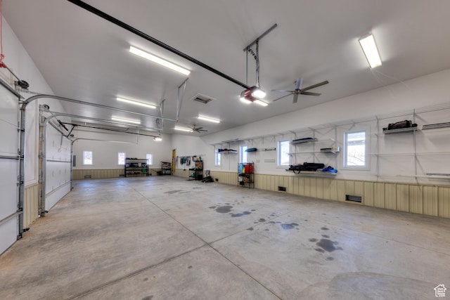 4230 S Beeman Rd, Moab, UT 84532 - garage featuring ceiling fan and a garage door opener