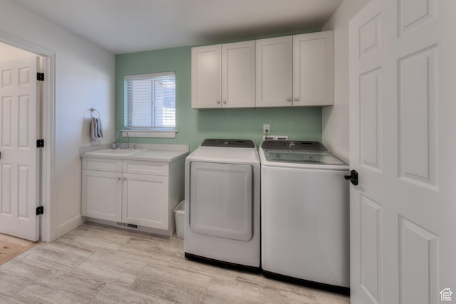 4230 S Beeman Rd, Moab, UT 84532 - laundry room featuring cabinets, sink, and washing machine and dryer
