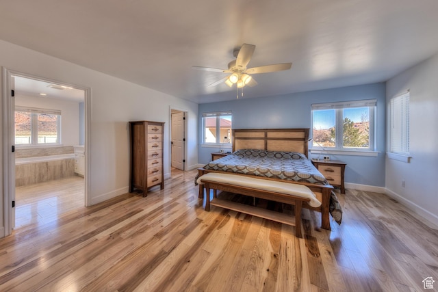 4230 S Beeman Rd, Moab, UT 84532 - bedroom with multiple windows, ceiling fan, and light hardwood / wood-style flooring