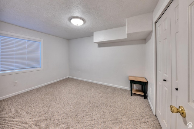 4230 S Beeman Rd, Moab, UT 84532 - unfurnished bedroom with light colored carpet, a textured ceiling, and a closet