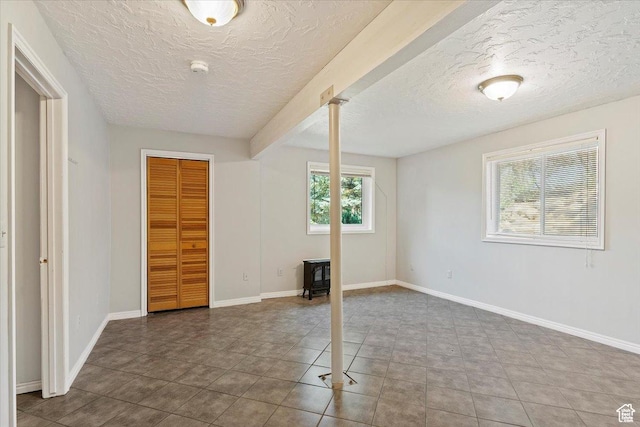 3388 N Eden Hills Dr, Eden, UT 84310 - spare room with tile patterned flooring and a textured ceiling