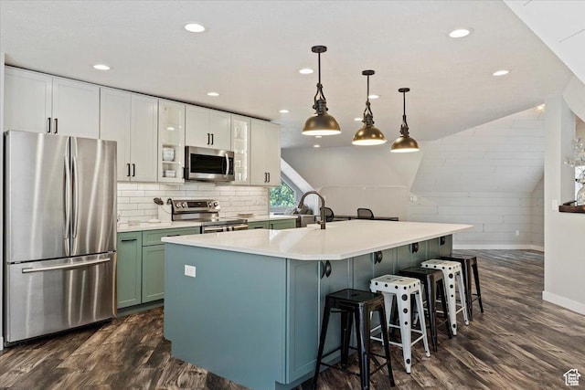 3388 N Eden Hills Dr, Eden, UT 84310 - kitchen with appliances with stainless steel finishes, white cabinetry, lofted ceiling, hanging light fixtures, and dark wood-type flooring