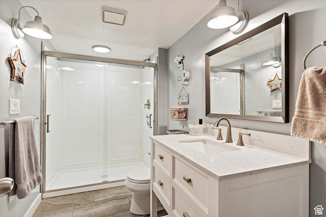 3388 N Eden Hills Dr, Eden, UT 84310 - bathroom featuring walk in shower, vanity, toilet, and a textured ceiling