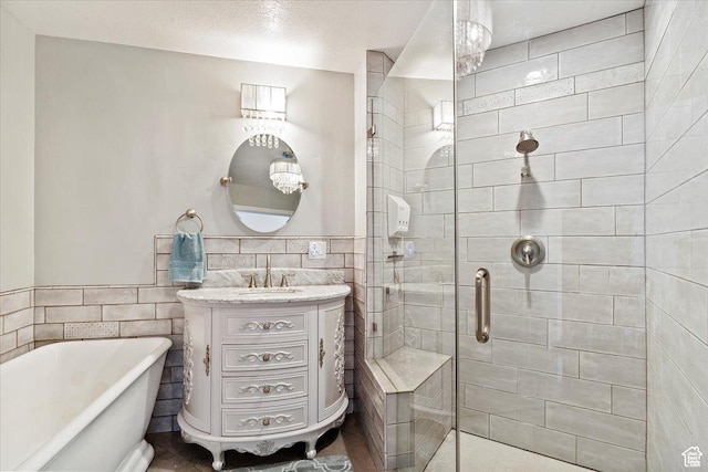 3388 N Eden Hills Dr, Eden, UT 84310 - bathroom featuring vanity, separate shower and tub, and tile walls