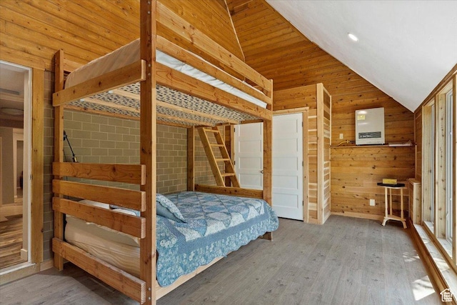 3388 N Eden Hills Dr, Eden, UT 84310 - unfurnished bedroom with vaulted ceiling, hardwood / wood-style floors, and wooden walls