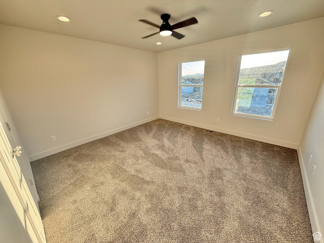 empty room with recessed lighting, baseboards, carpet floors, and ceiling fan