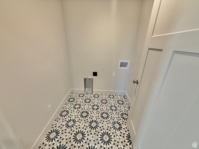 laundry room featuring tile patterned floors, baseboards, washer hookup, and laundry area