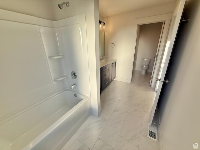 full bathroom with toilet, marble finish floor, shower / tub combination, baseboards, and vanity