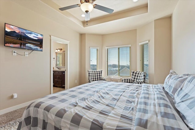 1321 Highland Blvd N, Brigham City, UT 84302 - bedroom with carpet floors, a tray ceiling, baseboards, ensuite bath, and a ceiling fan