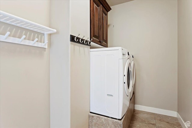 1321 Highland Blvd N, Brigham City, UT 84302 - clothes washing area with separate washer and dryer, cabinet space, and baseboards