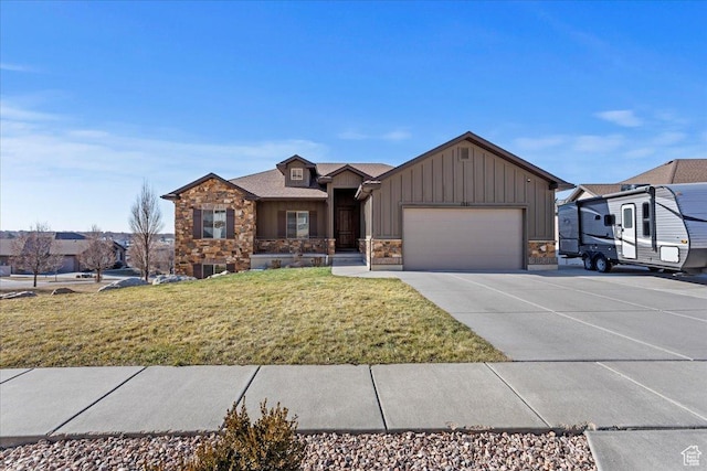 view of front of house with a garage and a front yard